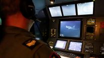 A RAF Typhoon is refuelled by the RAF Voyager, monitored from within the tanker cockpit