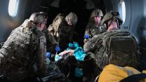 Medics practise a simulated medical emergency on board a USAF C-146A Wolfhound (Picture: USAF) Medics practice a simulated medical emergency on board a USAF C-146A Wolfhound