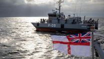 The sun shimmered on the water as the vessels worked together (Picture: Royal Navy)