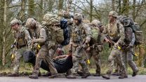 Soldiers from 2 Para extract a casualty during Exercise Orion in France - hauling a stretcher is something they are very familiar with, having done the stretcher race on P Company