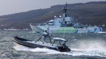 HMS Tyne is seen off the coast of Scotland during an exercise in which she was operating with five uncrewed boats that were being remotely piloted from 500 miles away