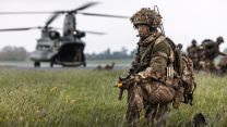 2nd Battalion The Royal Gurkha Rifles soldier takes a knee after disembarking from the back of a CH-47 Chinook 28042023 CREDIT MOD Crown Copy.jpg