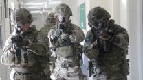 Personnel look for an 'enemy' target.