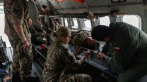 The RAF's Medical Team and Polish medics load a casualty onto an aircraft during a casevac (Picture: MOD)