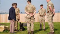 The Princess Royal with Coco and dog handlers during a visit to Kendrew Barracks in Cottesmore pic PA
