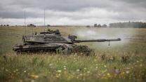 A Challenger 2 tank in a simulated battle during Exercise IRON CYCLONE 24072023 CREDIT MOD.jpg