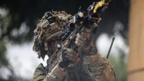 A Soldier in a fire position on an urban assault during Exercise Iron Cyclone 28072023 CREDIT MOD.jpg