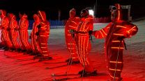 A close up view of the ESF members lit up at the Meribel Opening Ceremony 2025