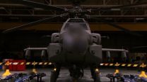 A front on view of a stationary Apache AH-64E helicopter.