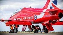 A member of the RAF checking over one of the Red Arrows