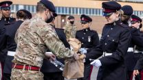 A member of the support team hands out lunches to a member of the British Army at Pirbright ahead of full dress rehearsal for the Duke of Edinburgh's funeral in London (Picture: MOD).