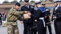 Support team hands out lunches to Royal Navy members as they wait at Pirbright before heading to London for a full dress rehearsal for Prince Philip's funeral (Picture: MOD).
