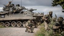 A section of Infantry soldier's attack a wood with a Warrior vehicle in support during Exercise IRON CYCLONE 28072023 CREDIT MOD.jpg