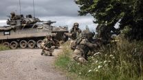 A section of Infantry soldier's attack a wood with a Warrior vehicle in support, Exercise IRON CYCLONE 28072023 CREDIT MOD.jpg