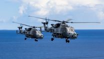 Royal Navy 815 Naval Air Squadron Wildcat HMA Mk2 (HMA2) helicopters, armed with Martlet lightweight multirole missiles, flying in a two-ship formation over British Forces Cyprus 