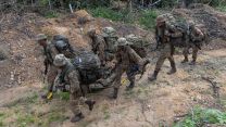 Airborne signallers during simulated casualty exercise carry soldier to safety 27012023 CREDIT MOD Crown Copyright .jpg