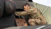 Aircraft Technician from 3 Regt Army Air Corps inspects an Apache AH64-E 26102022 CREDIT MOD Crown Copyright.jpg