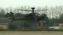 An Apache AH-64E helicopter in flight.