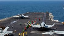 An FA-18E Super Hornet launches from the deck of USS Abraham Lincoln 