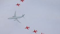 An incredible view of the Red Arrows flanking a Poseidon aircraft in a joint air display over Scotland (Picture: MOD).