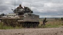 An infantry soldier gets out of a Warrior vehicle to attack an enemy position Exercise IRON CYCLONE 28072023 CREDIT MOD.jpg
