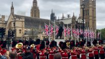 Armed Forces personnel march through Westminster following the State Opening of Parliament 