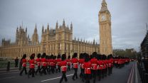 Army contingent march across Westminster Bridge before taking part in the coronation of King Charles III