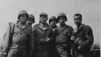 Bing Crosby (third left) with soldiers in France, 1944 (Picture: Decca Records).