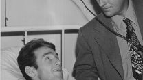 Mr Crosby (right) in a US Naval Hospital during the Second World War (Picture: Decca Records). 