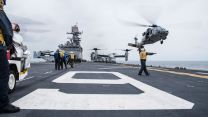 Aviation Boatswain's Mate Directs An MH-60S Knighthawk 