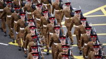 British Army's 1st Battalion of The Duke Of Lancaster's Regiment march through the streets of Liverpool on Armistice Day 111121 CREDIT PA ALAMY.jpg