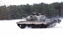 Challenger 2 Main Battle Tank from The Queens Royal Hussars moves across the snow during a combined arms manoeuvre 23012023 CREDIT MOD Crown Copyright.jpg