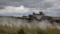 Challenger 2 tank travels over Salisbury Plain through smoke during an attack Exercise IRON CYCLONE 28072023 CREDIT MOD.jpg