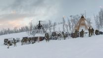 Marines at their base camp, with Viking armoured personnel vehicles in the background