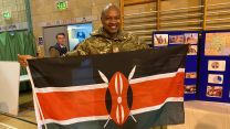 Commonwealh Day Celebration at Baker Barracks, Thorney Island -Bdr Kager of 16 Regime Royal Artillery holding the Kenyan National flag 14032022 CREDIT BFBS 