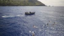 Crew enjoy a dip while the ship is anchored at Bounty Bay