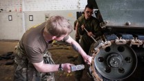 REME Mechanics Change Rubber Parts On An AS90 Track