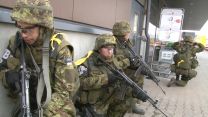 2nd Infantry Brigade acting as the 'enemy' and taking cover in a civilian inhabited town.