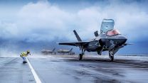 F-35 stealth fighter kicking up spray on the deck of aircraft carrier HMS Queen Elizabeth (Picture: Royal Navy). F-35 stealth fighter kicking up spray on the deck of aircraft carrier HMS Queen Elizabeth 24102021 Credit Navy.jpg