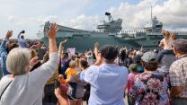 Familys waving from round tower as HMS Prince of Wales leaves Portsmouth 01092023 CREDIT MOD.jpg