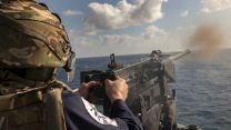 HMS Defender's crew participates in a Small Arms Firing At Sea in the Bay of Biscay as part of training for the Carrier Strike Group deployment (Picture: MOD).
