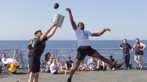 HMS Defender's ship's company enjoys a game of bucket ball before going alongside Soudha Bay in Greece (Picture: MOD).