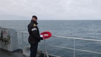 HMS Echo's Commander Coles prepares to cast wreath with the Marshal Ustinov a few hundred yards away 20092021 Credit Royal Navy.jpg