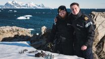 HMS Protector sailors Lts Jonny Talbor and Max Friswell with Warhammer pieces in the snow11022023 CREDIT Royal Navy.jpg