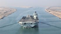 HMS Queen Elizabeth passed through the Suez Canal in Egypt on Carrier Strike Deployment in July (Picture: HMS QE Twitter). HMS Queen Elizabeth passes through the Suez Canal in Egypt on Carrier Strike Deployment 060721 CREDIT HMS Queen Elizabeth Twitter.jpg