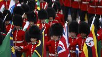 Household Division Guardsman carrying Commonwealth flags during the coronation 060523 CREDIT MOD.