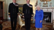 Queen Elizabeth II meeting the outgoing commanding officer of HMS Queen Elizabeth, Commordore Stephen Moorhouse (left) and his successor, Captain Angus Essenhigh, in 2020 (Picture: PA Images/Alamy Stock Photo). Queen Elizabeth II meeting the outgoing commanding officer of HMS Queen Elizabeth, Commordore Stephen Moorhouse (left) and his successor, Captain Angus Essenhigh in 2020 (Picture: PA Images/Alamy Stock Photo).