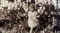 The young princess gathers flowers in 1930 (Picture: World History Archive/Alamy Stock Photo). The young princess gathers flowers in 1930 (Picture: World History Archive/Alamy Stock Photo).