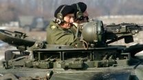 Colonel-in-Chief Prince Charles drives a tank during a visit to 5th Royal Inniskilling Dragoon Guards, in Tidworth in June 1985 (David Cooper, Alamy Stock Photo).