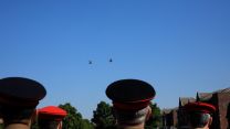 Junior soldiers look overhead at a flypast to mark their graduation from AFC Harrogate.